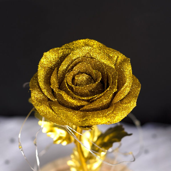 petales rose or sous cloche